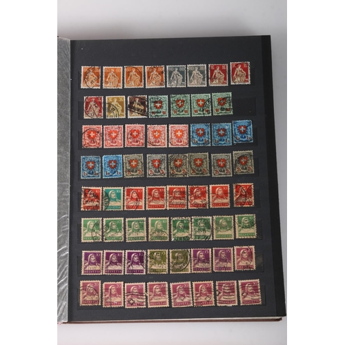 466 - SWITZERLAND, a Swiss stamp collection held in four albums to include an album of mint issues from 19... 