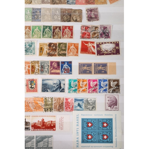 466 - SWITZERLAND, a Swiss stamp collection held in four albums to include an album of mint issues from 19... 