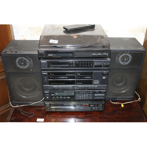 635 - Toshiba music system with two speakers to include a turntable, tuners, cassette decks, etc.