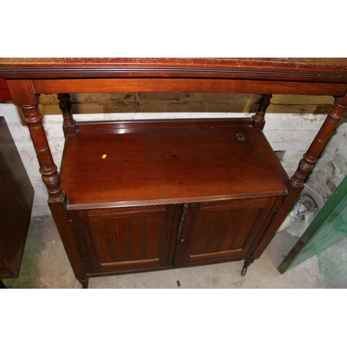 652 - Mahogany buffet with back gallery and cupboard, raised on castors.