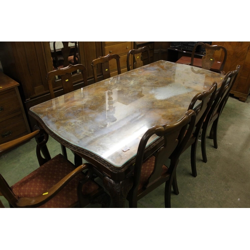 657 - Reproduction figured walnut dining table with glass top along with six matching chairs and two other... 