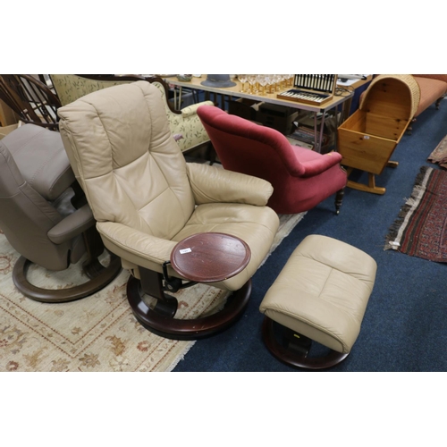 665 - Ekornes Stressless leather armchair and matching footstool in beige.