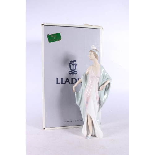 169 - Lladro porcelain figurine 05787 Sophisticate (Dama De Fiesta), 26cm tall, boxed.