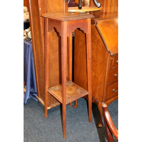 694 - Edwardian two-tier plant stand with carved thistle decoration.