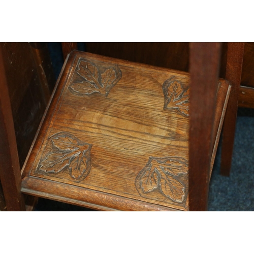 694 - Edwardian two-tier plant stand with carved thistle decoration.