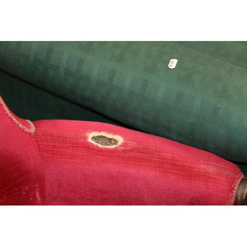 698 - Padded green upholstered armchair and a pink upholstered armchair.