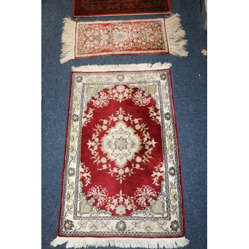 705 - Topkapi carpet, another small rug, and a rust red Persian runner, 275cm x 69cm.