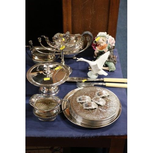 70 - Collection of mixed plated silverware to include placemats, decanter labels, tea set and candelabra.... 