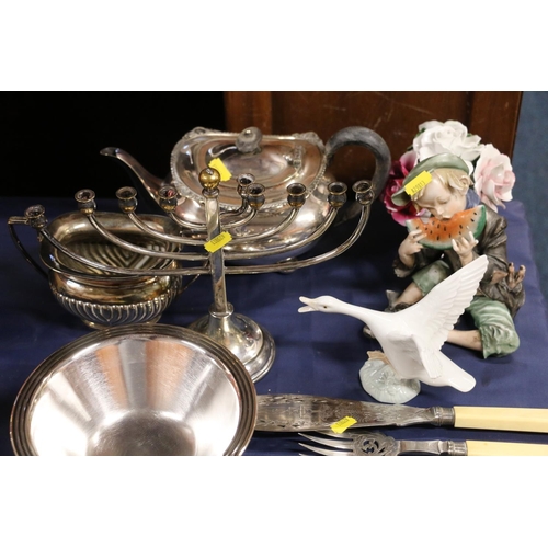 70 - Collection of mixed plated silverware to include placemats, decanter labels, tea set and candelabra.... 