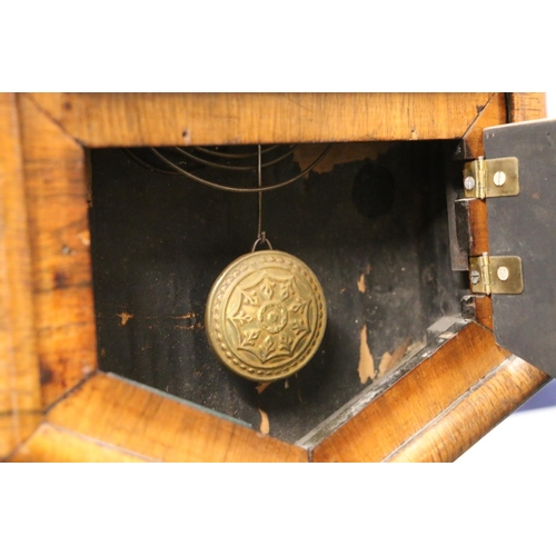 71 - Octagonal rosewood wall clock with pendulum below.