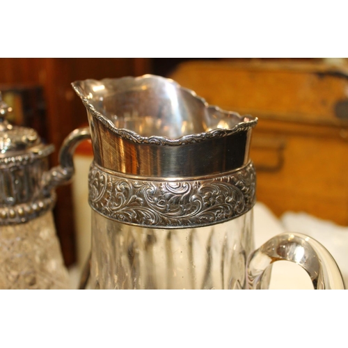 196B - Four piece silver plated tea service, glass and silver plate jug, ewer and an finely decorated entre... 