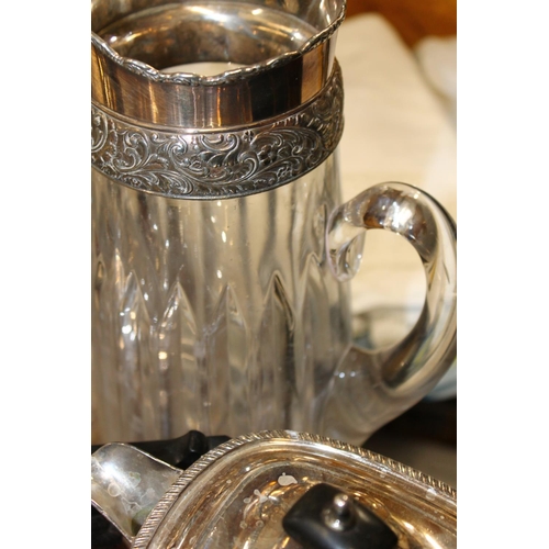 196B - Four piece silver plated tea service, glass and silver plate jug, ewer and an finely decorated entre... 