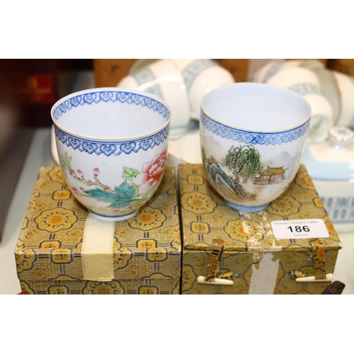 186 - Two oriental fine porcelain cups, in original boxes.