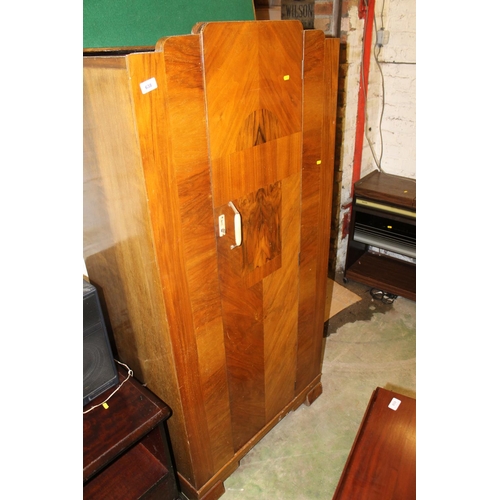 638 - Art Deco figured walnut single door wardrobe.