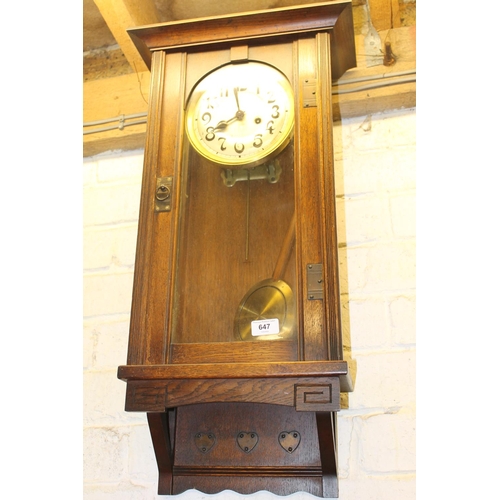 647 - 1930s oak cased wall clock.