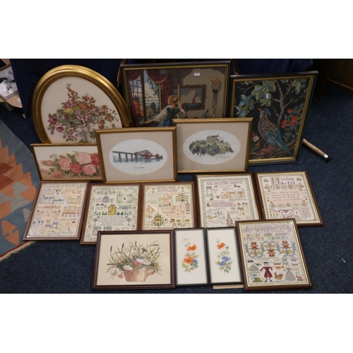 410 - Fifteen framed needlework panels.