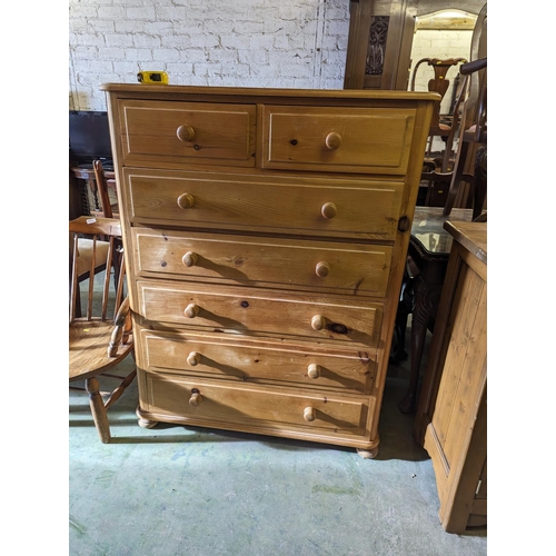 706 - Pine chest of two short over five long drawers raised on bun feet, 100cm wide, 131cm tall, 51cm deep... 