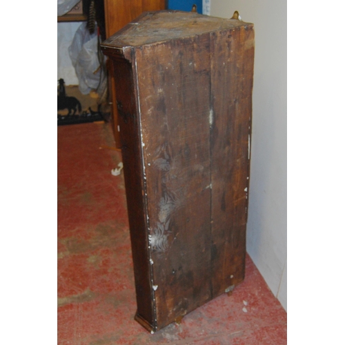 433 - 18th century George III oak corner cupboard, the hinged door enclosing later painted shelving, brass... 