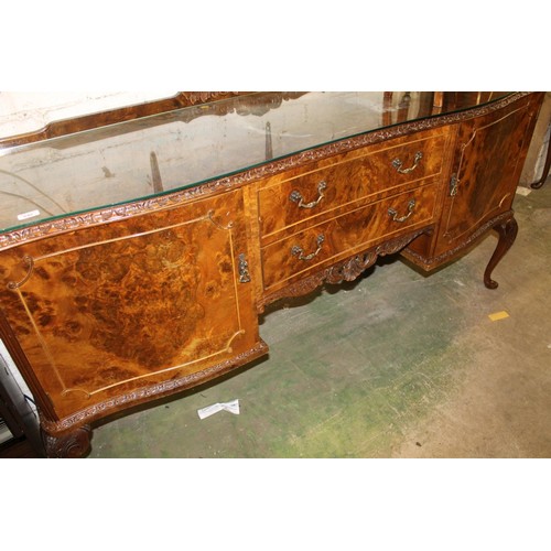 641 - 20th century reproduction figured walnut sideboard with glass top.