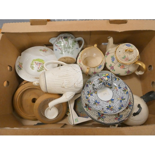 124 - Two boxes of various items to include tea pots, bowls etc.