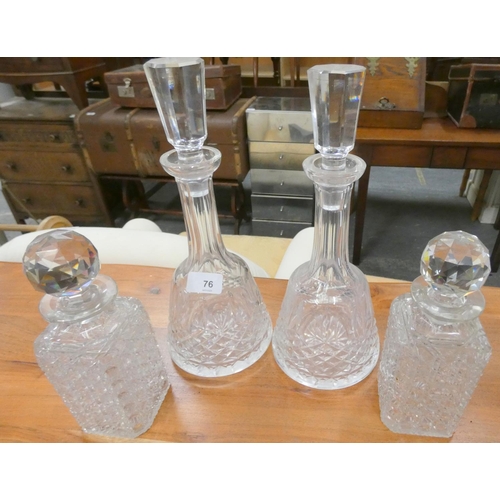 76 - Four cut glass wine and spirit decanters.