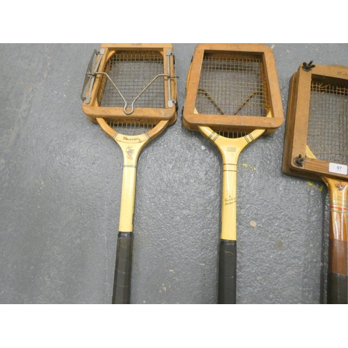 97 - Four vintage tennis rackets to include Slazenger and Dunlop.