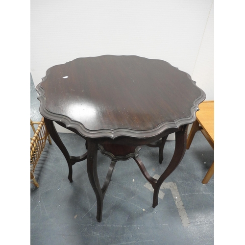 322 - Teak coffee table and a mahogany piecrust-edge window table.  (2)