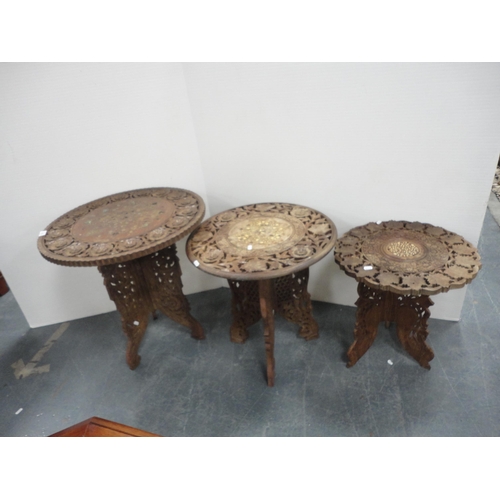 324 - Three Indian carved teak occasional tables.