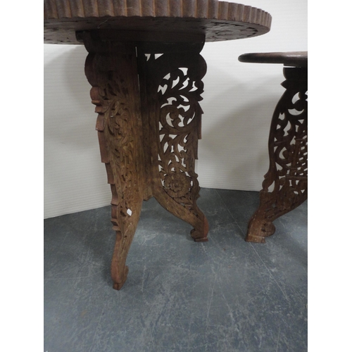 324 - Three Indian carved teak occasional tables.