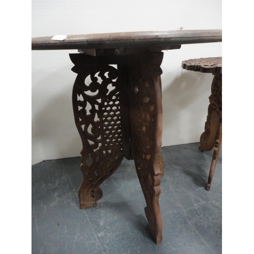 324 - Three Indian carved teak occasional tables.