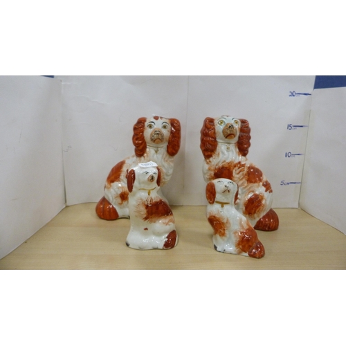 11 - Pair of Staffordshire wally dogs, another larger, and four rust-decorated wally dogs.