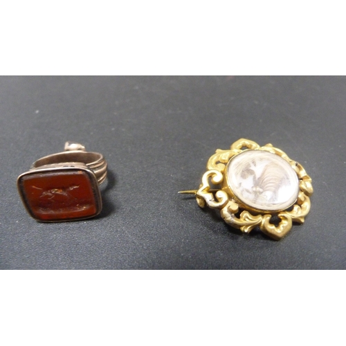 231 - Victorian yellow metal mourning brooch and an antique seal fob.  (2)