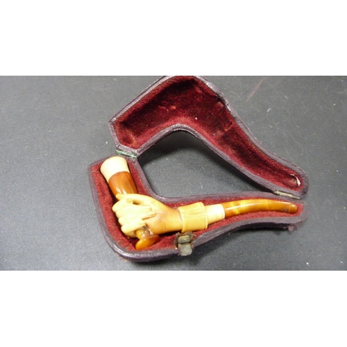 236 - Group of meerschaum pipes and cheroot holders to include a silver-mounted cheroot holder, all in fit... 