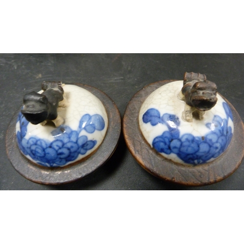 252 - Pair of Chinese blue and white crackle glaze baluster vases with covers and oxidised bands.