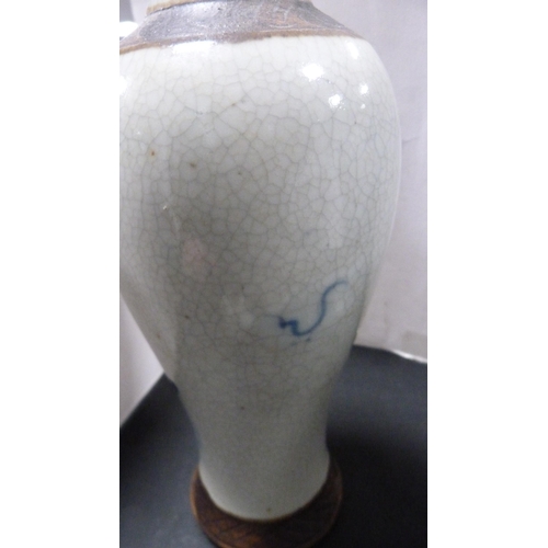 252 - Pair of Chinese blue and white crackle glaze baluster vases with covers and oxidised bands.