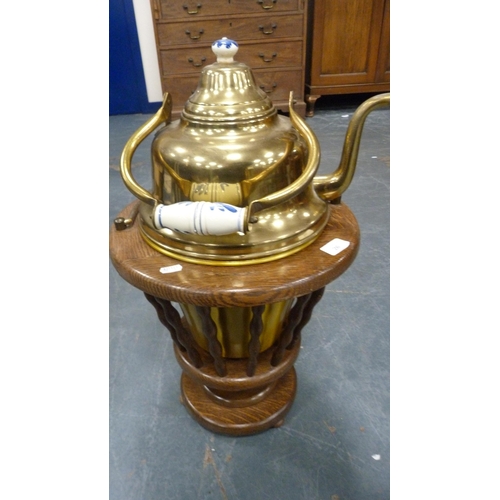 26 - Large Eastern brass kettle on oak jardinière stand.