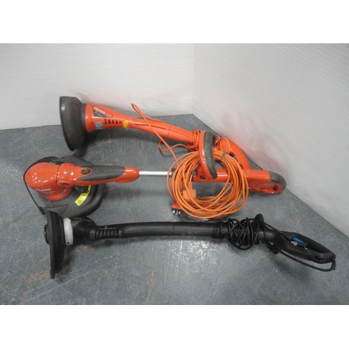 306 - Two Flymo strimmers and a Macallister strimmer, all electric.