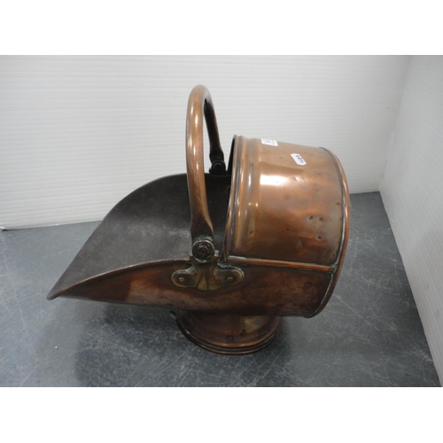 318 - Two copper coal helmets.