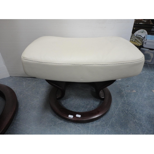 320 - Stressless cream leather reclining armchair with footstool.