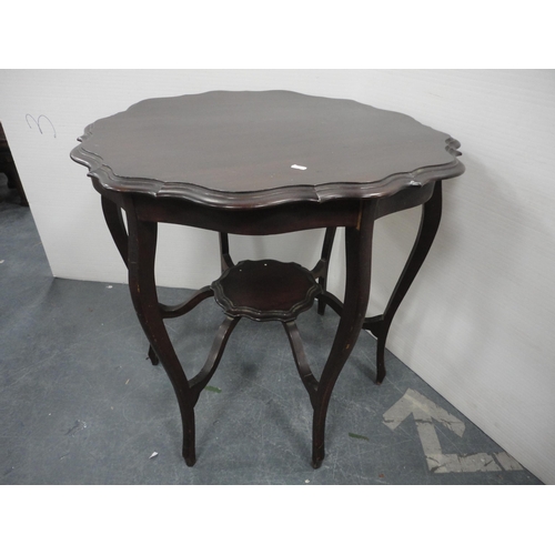 322 - Teak coffee table and a mahogany piecrust-edge window table.  (2)