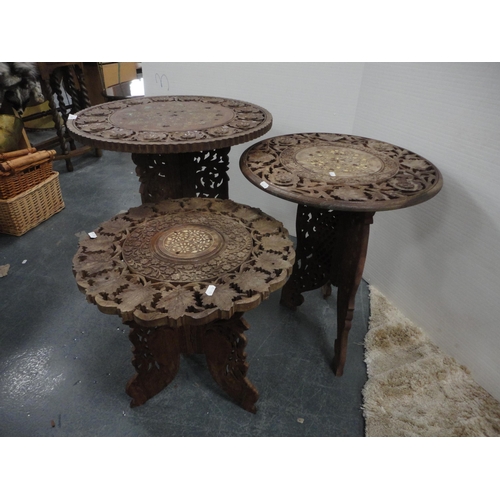 324 - Three Indian carved teak occasional tables.