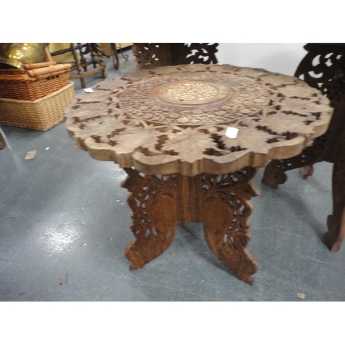 324 - Three Indian carved teak occasional tables.