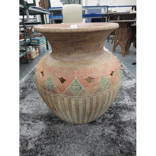 328 - Large Eastern-style terracotta planter in the form of a vase.