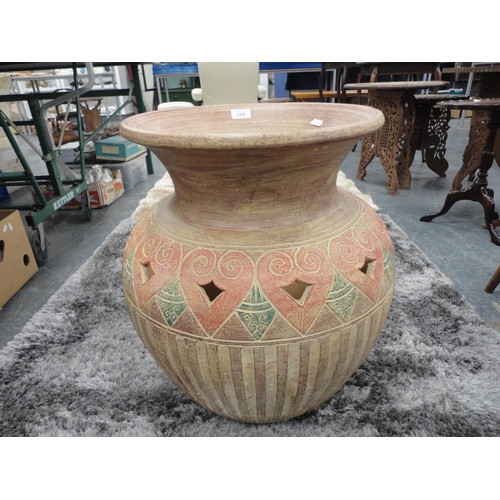 328 - Large Eastern-style terracotta planter in the form of a vase.