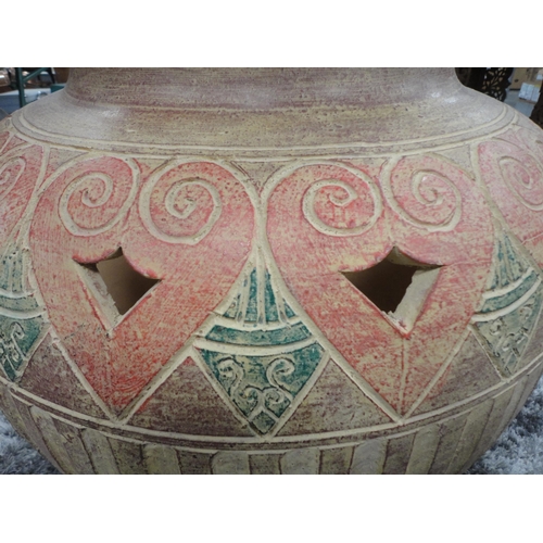 328 - Large Eastern-style terracotta planter in the form of a vase.