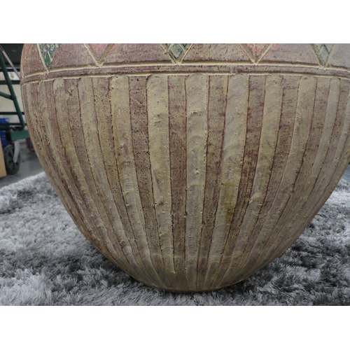 328 - Large Eastern-style terracotta planter in the form of a vase.