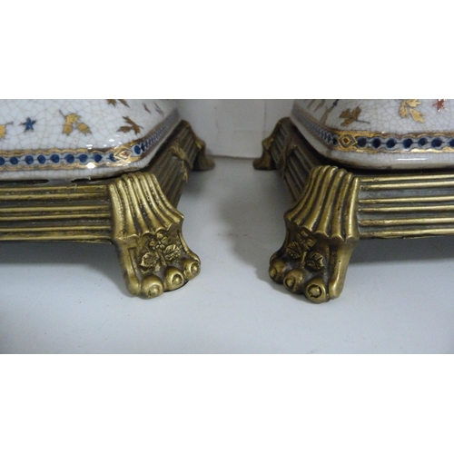 64 - Pair of reproduction French-style vases on gilt bases.