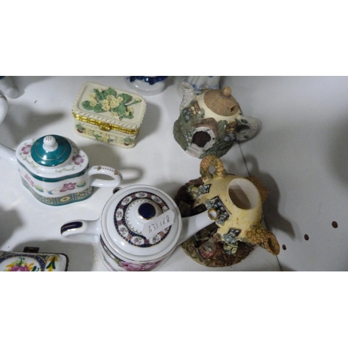 79 - Collection of Continental miniature teapots, patch boxes, Peter Rabbit figures and other continental... 