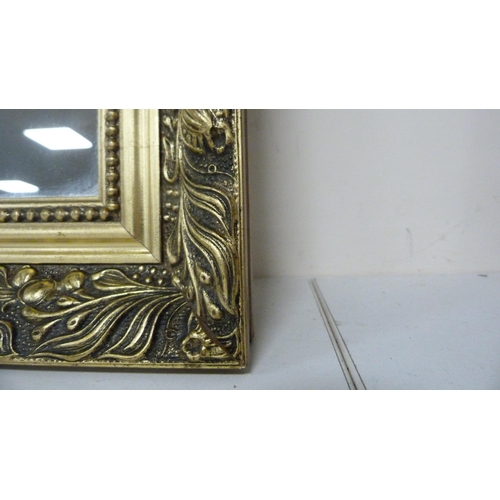 83 - Reproduction gilt framed wall mirror, print after Monet and a contemporary wall hanging.  (3)