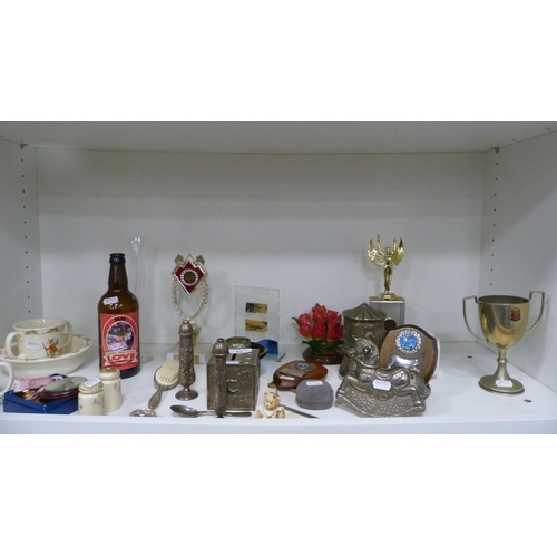 85 - Collection of trophies, Bunnykins nursery ware, rocking horse money box etc (one shelf).